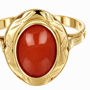 Anello da donna in oro giallo 18 carati con corallo centrale di forma ovale