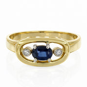 Anello da donna in oro giallo 18 carati con zaffiro centrale e due diamanti laterali